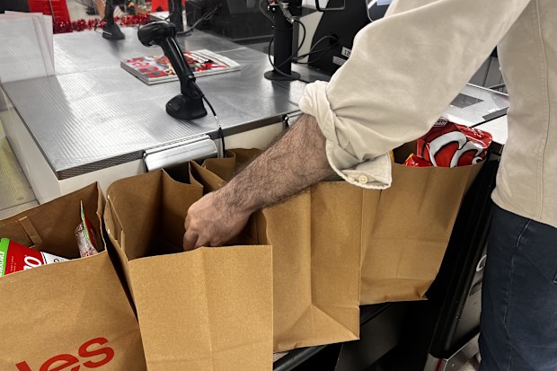 shopping bags at supermarket groceries coles woolworths aldi 