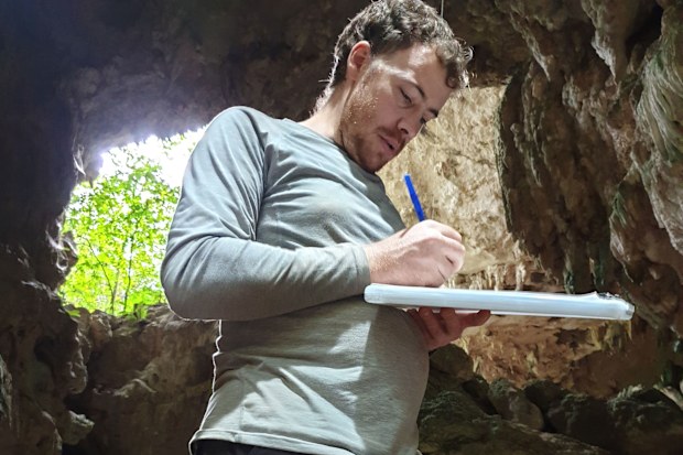 Griffith University archaeologist Dr Tim Maloney documents progress of the excavation.