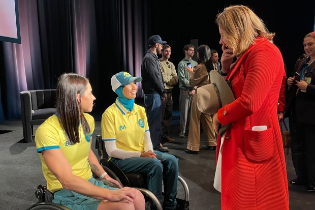 Federal Minister for Sport Anika Wells speaks with Australian Paralympic team athletes.