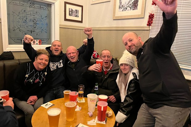 Wrexham FC fans celebrates Wrexham's 2-1 win over Colchester on December 16, 2023 inside The Turf pub