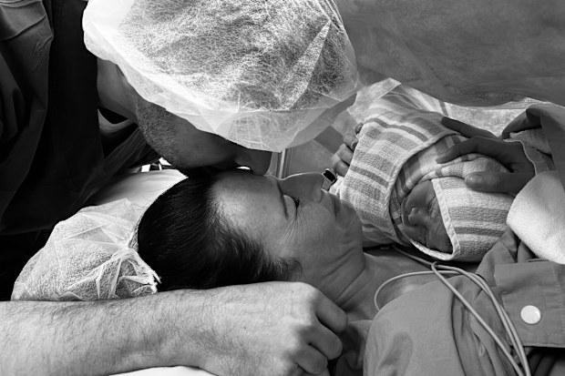 Laura and Dave Tucker with their son Jackson Bailey, who was born weeks after she lost her dad.