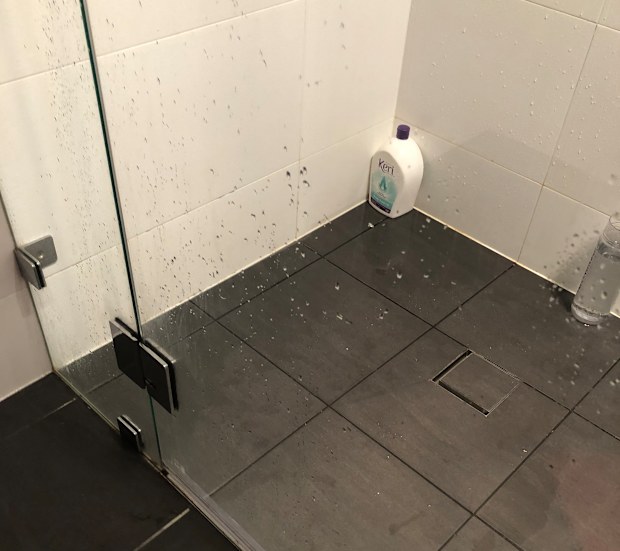 Woman tests viral cleaning hack using a dishwasher tablet on soap scum