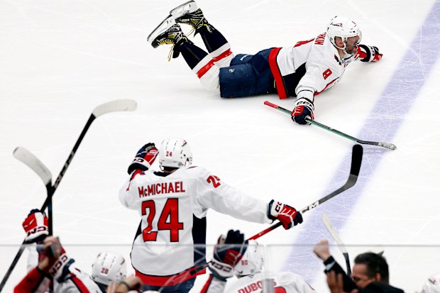 Alex Ovechkin of the Washington Capitals celebrates after scoring his 895th career goal against the New York Islanders to become the NHL all-time goals leader.