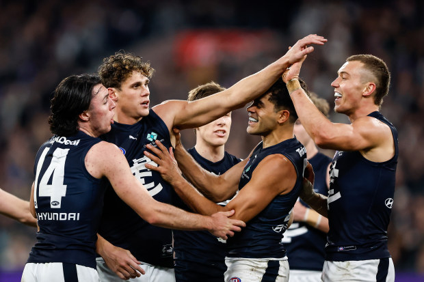 MELBOURNE, AUSTRALIA - JULY 28: Charlie Curnow of the Blues celebrates a goal with teammates during the 2023 AFL Round 20 match between the Collingwood Magpies and the Carlton Blues at The Melbourne Cricket Ground on July 28, 2023 in Melbourne, Australia. (Photo by Dylan Burns/AFL Photos via Getty Images)