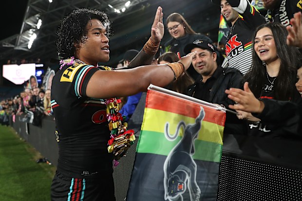 Brian To'o of the Panthers celebrates with fans.