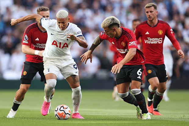 Richarlison of Tottenham Hotspur controls the ball whilst under pressure from Lisandro Martinez of Manchester United during the Premier League match between Tottenham Hotspur and Manchester United at Tottenham Hotspur Stadium on August 19, 2023 in London, England. (Photo by Julian Finney/Getty Images)
