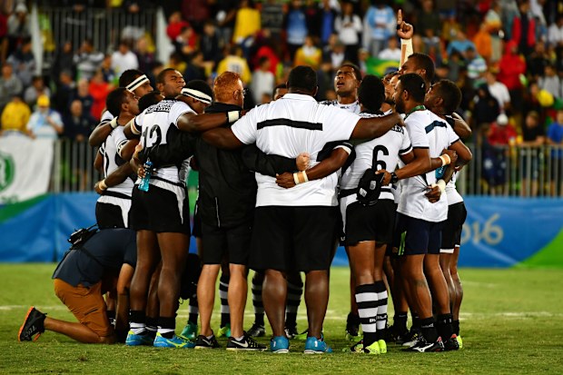The Fijians singing a hymn after clinching gold.