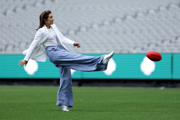 MELBOURNE, AUSTRALIA - MARCH 17: Queen Mary of Denmark kicks a ball during a visit to the Melbourne Cricket Ground on March 17, 2026 in Melbourne, Australia. Denmark's King Frederik X and Queen Mary are on a five-day state visit to Australia. (Photo by Martin Keep - Pool/Getty Images)