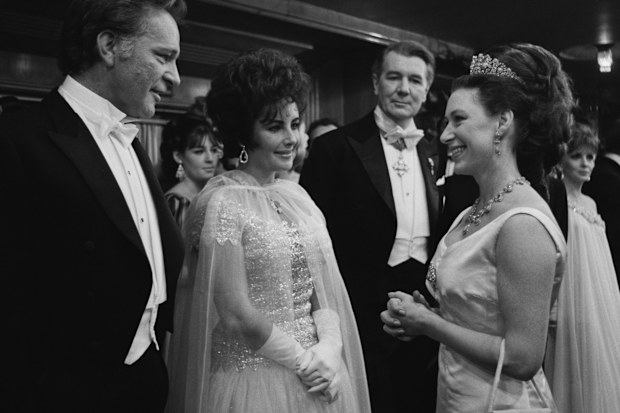 Princess Margaret chatting to Richard Burton and his wife Elizabeth Taylor at the Royal Film Performance of 'The Taming Of The Shrew' in 1967.