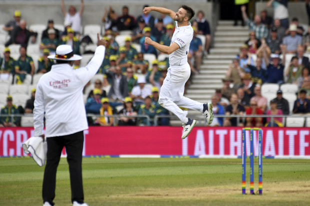 England's Mark Wood celebrates after dismissing Australia's Pat Cummins during the third day of the third Ashes Test match between England and Australia at Headingley.