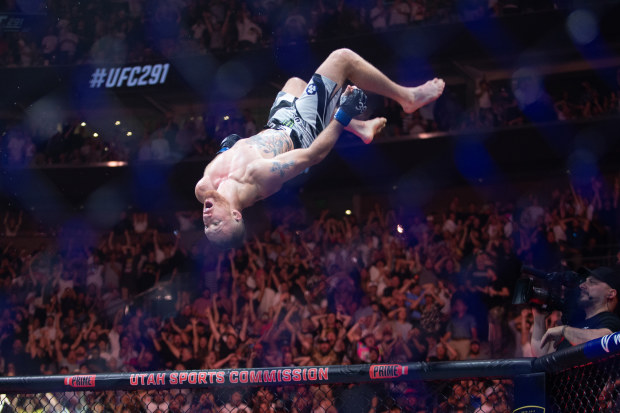 Justin Gaethje flips after beating Dustin Poirier during their title lightweight fight at UFC 291.