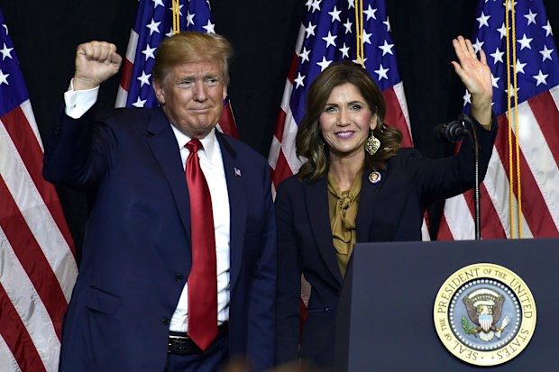 President Donald Trump with Kristi Noem