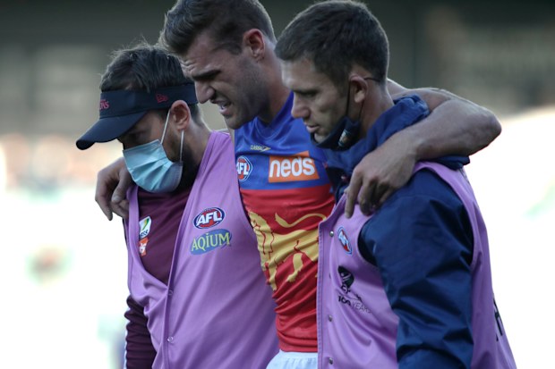 LAUNCESTON, AUSTRALIA - AUGUST 01:Jack Payne of the Lions leaves the field injured during the 2021 AFL Round 20 match between the Hawthorn Hawks and the Brisbane Lions at UTAS Stadium on August 1, 2021 in Launceston, Australia. (Photo by Grant Viney/AFL Photos)