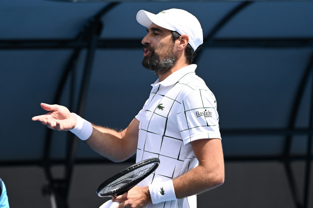 Jeremy Chardy of France speaks to chair umpire Miriam Bley.