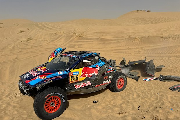 The car of Carlos Sainz after a rollover in the Dakar Rally.