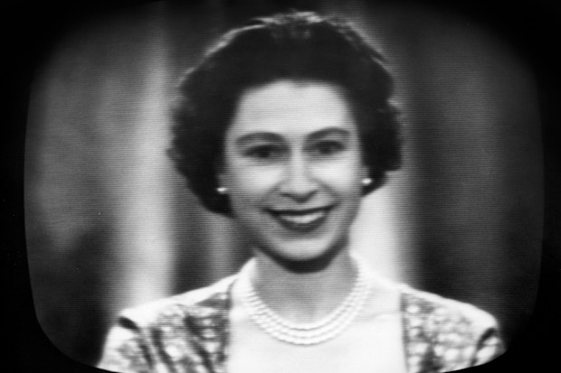 The warm, friendly smile of the Queen seen in close-up on a television screen as she concludes her traditional Christmas day broadcast to her people, which was televised this year for the first time and carried by both the BBC and ITV. The Queen ended her message: 'I hope that 1958 may bring you God's blessing and all the things you long for. And so I wish you all, young and old, wherever you may be, all the fun and enjoyment and the peace of a very happy Christmas'. She was speaking from the Lo