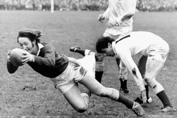 Wales' JPR Williams dives over to score a try.