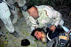 Saddam Hussein, the fifth president of Iraq was found hiding in a camouflaged hole in the ground by US soldiers near Tikrit, Iraq.