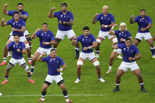 Samoa players perform siva tau before the Rugby World Cup match against England.