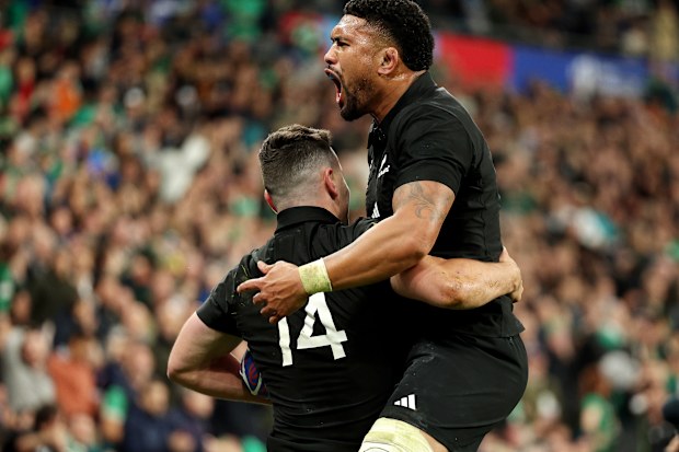 Will Jordan of New Zealand celebrates scoring his team's third try.