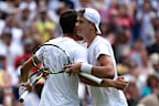Holger Rune of Denmark shakes hands with Carlos Alcaraz of Spain following the Men's Singles Quarter Final match during day ten of The Championships Wimbledon 2023 at All England Lawn Tennis and Croquet Club on July 12, 2023 in London, England. (Photo by Clive Brunskill/Getty Images)