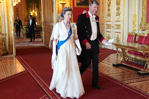 Princess Anne and her husband Tim Lawrence arrive for the State Banquet at Windsor Castle in Windsor, England, Tuesday, July 8, 2025. (Aaron Chown/Pool Photo via AP)