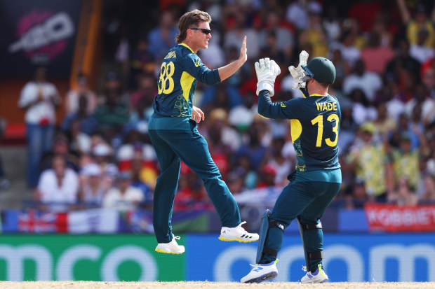 Adam Zampa of Australia celebrates with team mate Matthew Wade of Australia after bowling Phil Salt of England during the ICC Men's T20 Cricket World Cup West Indies & USA 2024 match between Australia  and England at  Kensington Oval on June 08, 2024 in Bridgetown, Barbados. (Photo by Matthew Lewis-ICC/ICC via Getty Images)