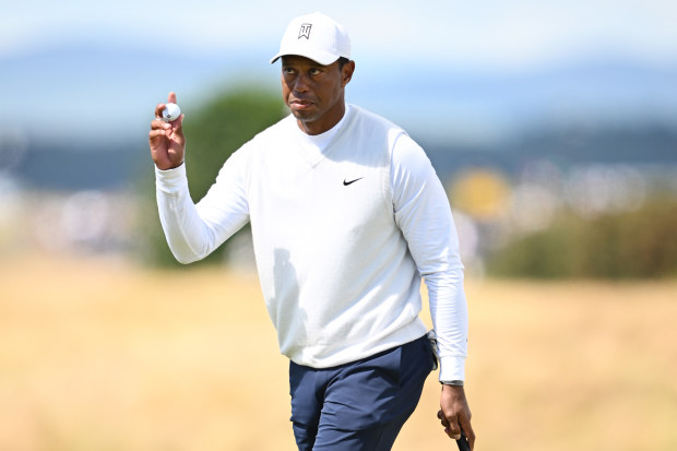 Tiger Woods of the United States acknowledges the crowd on the 17th green during Day Two of The 150th Open at St Andrews Old Course on July 15, 2022 in St Andrews, Scotland. (Photo by Stuart Franklin/R&A/R&A via Getty Images)