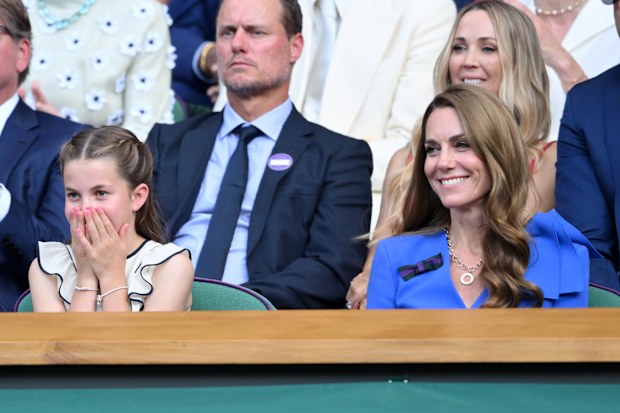 Princess Charlotte of Wales and Catherine, Princess of Wales attend day fourteen of the Wimbledon Tennis Championships at the All England Lawn Tennis and Croquet Club at All England Lawn Tennis and Croquet Club on July 13, 2025 in London, England. 