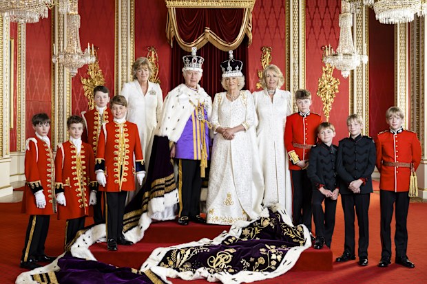 King Charles III and Queen Camilla with their Pages of Honour and Ladies in Attendance on the day of the coronation in the Throne Room at Buckingham Palace. Pictured (left to right) Ralph Tollemache, Lord Oliver Cholmondeley, Nicholas Barclay, Prince George of Wales, the Marchioness of Lansdowne, the Queen's sister Annabel Elliot, the Queen's grandson Freddy Parker Bowles, the Queen's great-nephew Arthur Elliot, and the Queen's grandsons Gus Lopes and Louis Lopes.