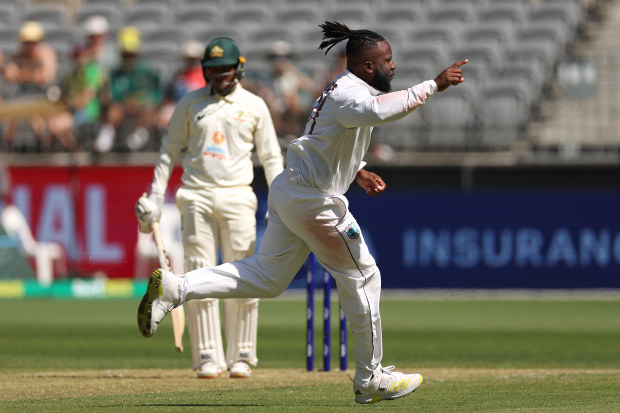 Kyle Mayers of the West Indies celebrates taking the wicket of Usman Khawaja. (Photo by Cameron Spencer/Getty Images)