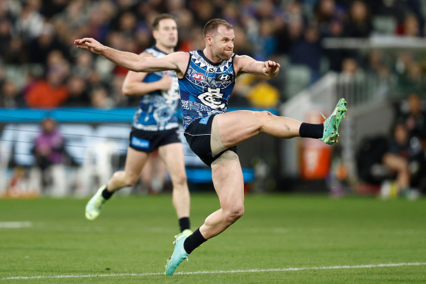 MELBOURNE, AUSTRALIA - MAY 21: Sam Docherty of the Blues kicks the ball during the 2023 AFL Round 10 match between the Carlton Blues and the Collingwood Magpies at the Melbourne Cricket Ground on May 21, 2023 in Melbourne, Australia. (Photo by Michael Willson/AFL Photos)