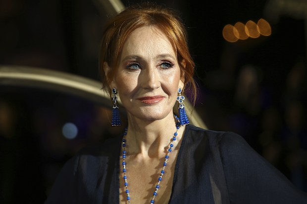 J.K. Rowling poses for photographers upon her arrival at the premiere of the film 'Fantastic Beasts: The Crimes of Grindelwald', in London, Nov. 13, 2018. 