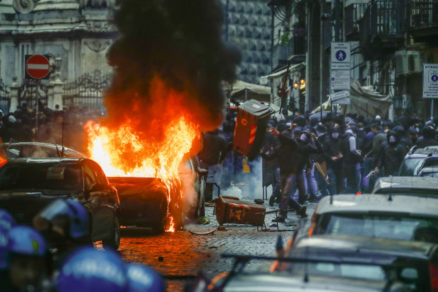 Supporters of Eitracht Frankfurt clash with police in Naples.