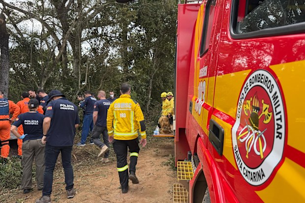 Emergency services operate at the area where a hot air balloon crashed, leaving at least 8 dead in Santa Catarina, Brazil on June 21, 2025.