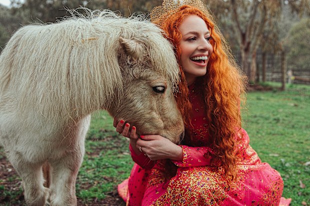 Emma Watkins poses for the Ovarian Cancer Research Foundation's (OCRF) Frocktober campaign.