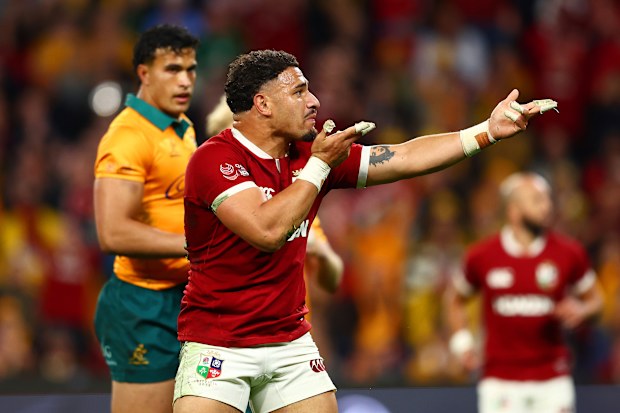 Sione Tuipulotu of the British and Irish Lions celebrates after scoring a try.
