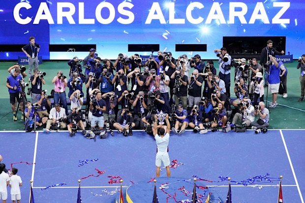 Carlos Alcaraz, of Spain, holds up the trophy after defeating Casper Ruud, of Norway, to win the men's singles final of the U.S. Open tennis championships, Sunday, Sept. 11, 2022, in New York. (AP Photo/Mary Altaffer)