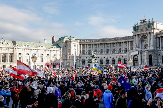 People take part in a demonstration against the country's coronavirus restrictions in Vienna, Austria