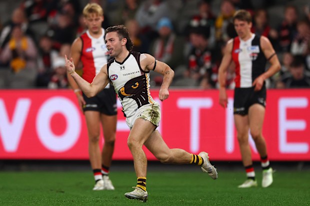 Nick Watson of the Hawks celebrates kicking a goal.