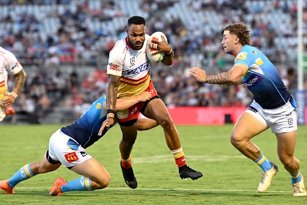 Hamiso Tabuai-Fidow of the Dolphins takes on the defence of the Gold Coast Titans. (Photo by Bradley Kanaris/Getty Images)