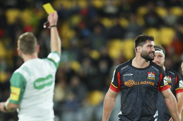 Referee Angus Gardner shows a yellow card to Luke Jacobson of the Chiefs during the Super Rugby Pacific semi-final match.