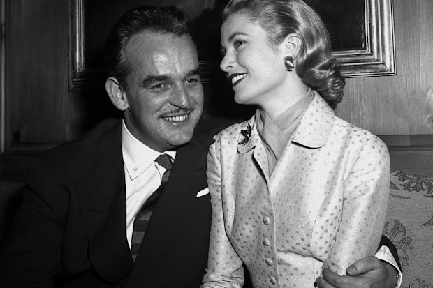 Prince Rainier III of Monaco and Grace Kelly, 26, pose for photographers at the Kelly home in Philadelphia after announcing their engagement yesterday. (Photo by FranK Hurley/NY Daily News Archive via Getty Images)