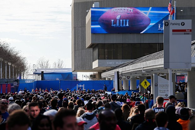 Fans walk into the NFL experience in Atlanta, Georgia.