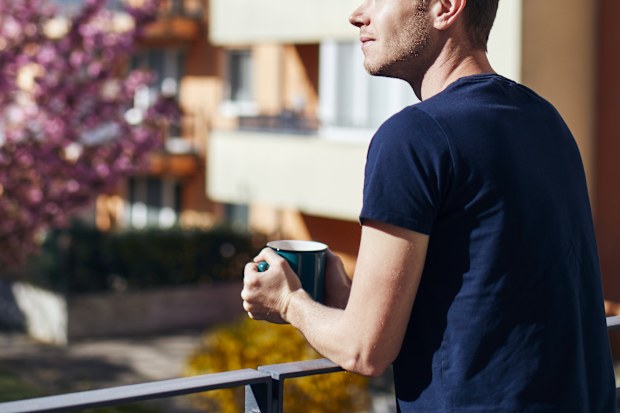 Man standing on balcony