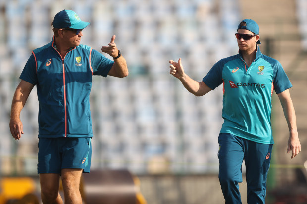 DELHI, INDIA - FEBRUARY 15: Australian coach Andrew McDonald and Steve Smith check the pitch during an Australia Test squad training session at Arun Jaitley Stadium on February 15, 2023 in Delhi, India. (Photo by Robert Cianflone/Getty Images)