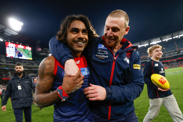 Simon Goodwin, Senior Coach of the Demons and Kysaiah Pickett of the Demons celebrate during the 2022 AFL Round 22 match between the Melbourne Demons and the Carlton Blues at the Melbourne Cricket Ground on August 13, 2022 in Melbourne, Australia. (Photo by Michael Willson/AFL Photos)