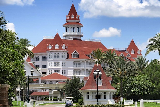 A view of Disney's Grand Floridian Resort main entrance, at Walt Disney World in Lake Buena Vista, Fla., Monday, June 22, 2020. The Villas at the Grand Floridian opened Monday as a part of select resorts in the first group to reopen since being shutdown by the coronavirus pandemic in March.  (Joe Burbank/Orlando Sentinel via AP)