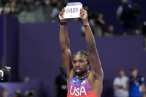 Noah Lyles, of the United States, celebrates after winning the men's 100 metres final at the Paris 2024 Olympic Games, Sunday, Aug. 4, 2024, in Saint-Denis, France. 