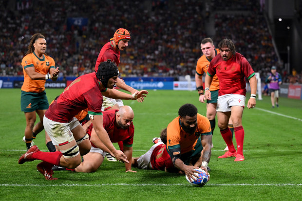 Marika Koroibete of Australia scores his team's fifth try.